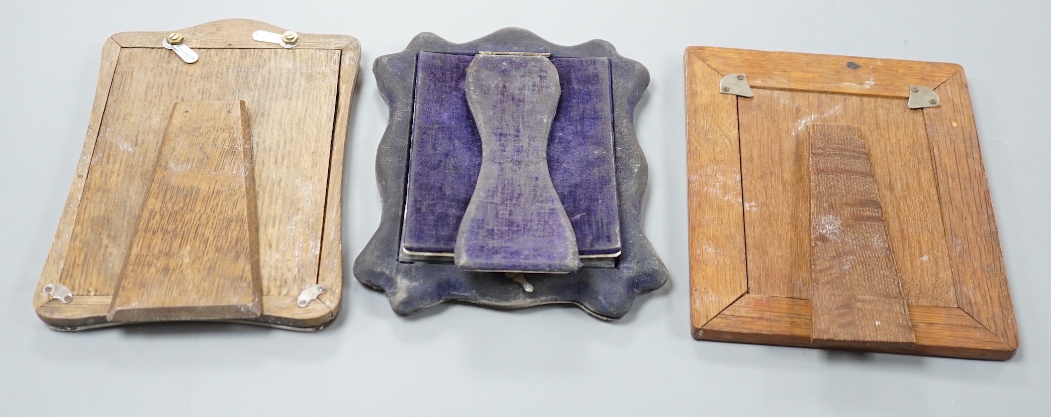 Three assorted early 20th century silver mounted photograph frames, including repousse, Birmingham, 1904, 18.6cm.